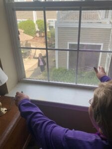 AL Resident, Peg Stempen celebrating her birthday, window visit style 1